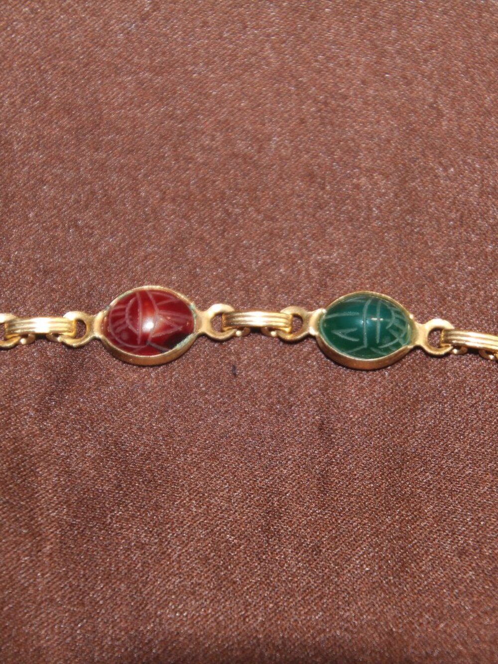 Scarb bracelet, gold tone.  Good condition.